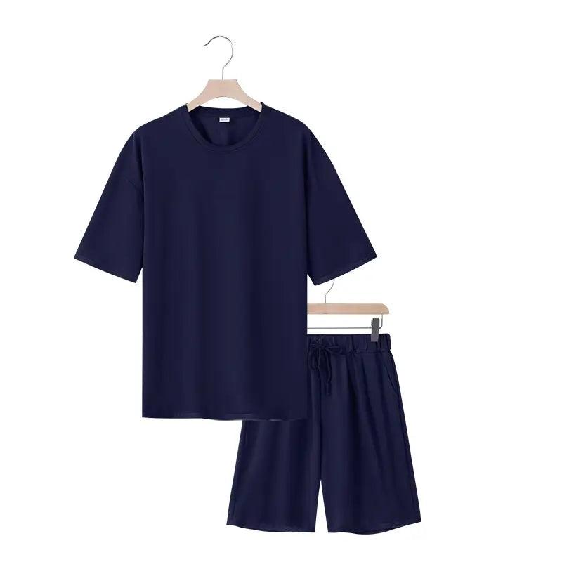 Conjunto veraniego de dos piezas para hombre en algodón azul marino, camiseta casual de manga corta a juego y conjunto de pantalones cortos.