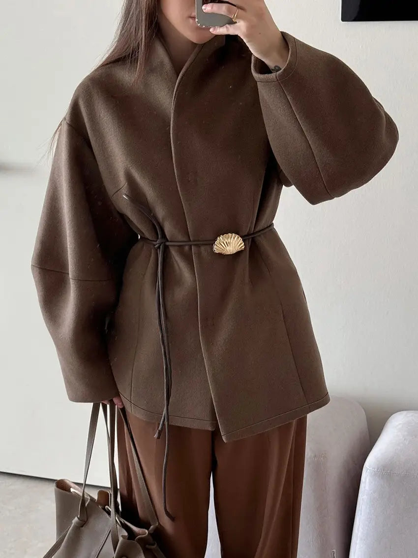 Brown woolen belted coat featuring a shell-shaped gold belt buckle designed for winter wear.