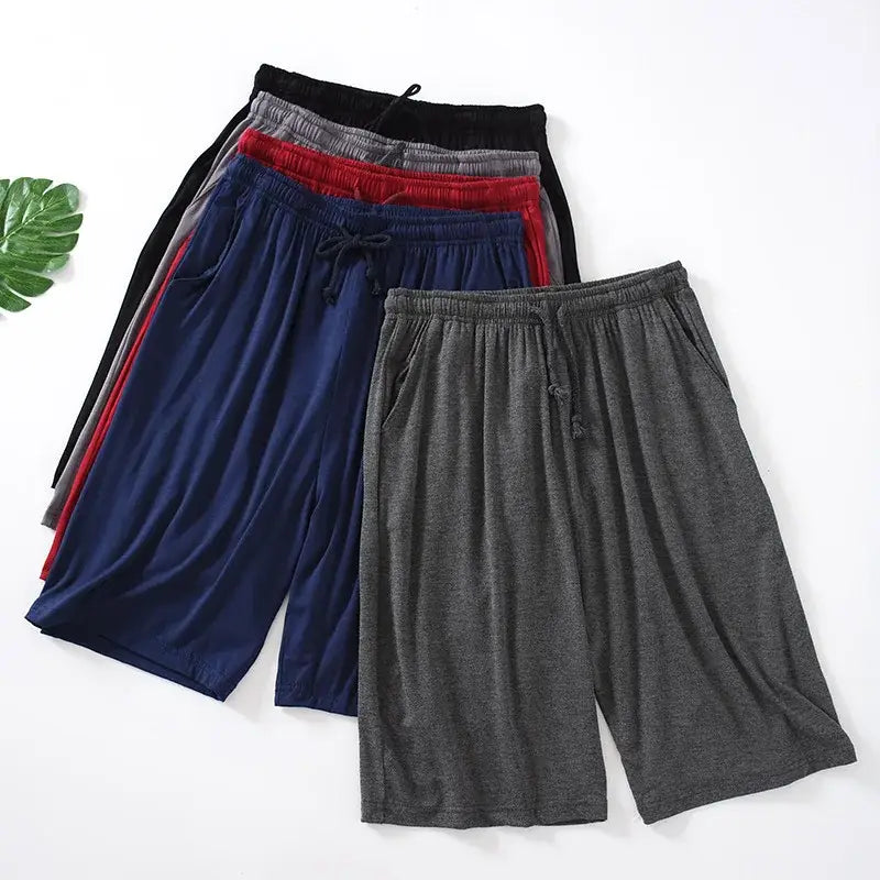 Eine Kollektion an Herren-Modal-Cotton-Loungewear-Shorts in Schwarz, Grau, Rot, Navyblau und meliertem Anthrazit mit lockerer Passform und Bund mit Kordelzug.