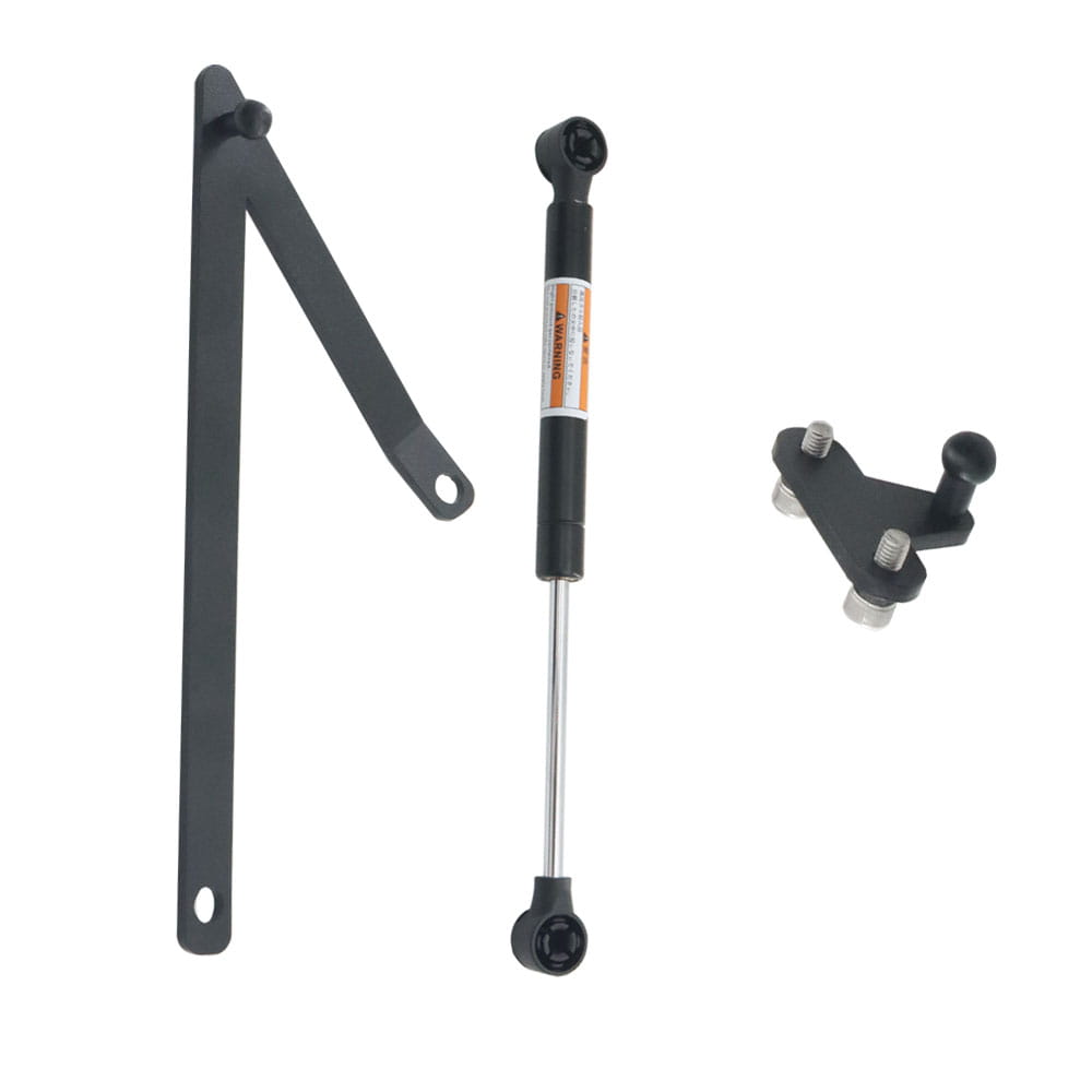 Black gas spring with chrome piston and orange warning label for Harley touring trunk support rod 2014-2023 shown from the back side.