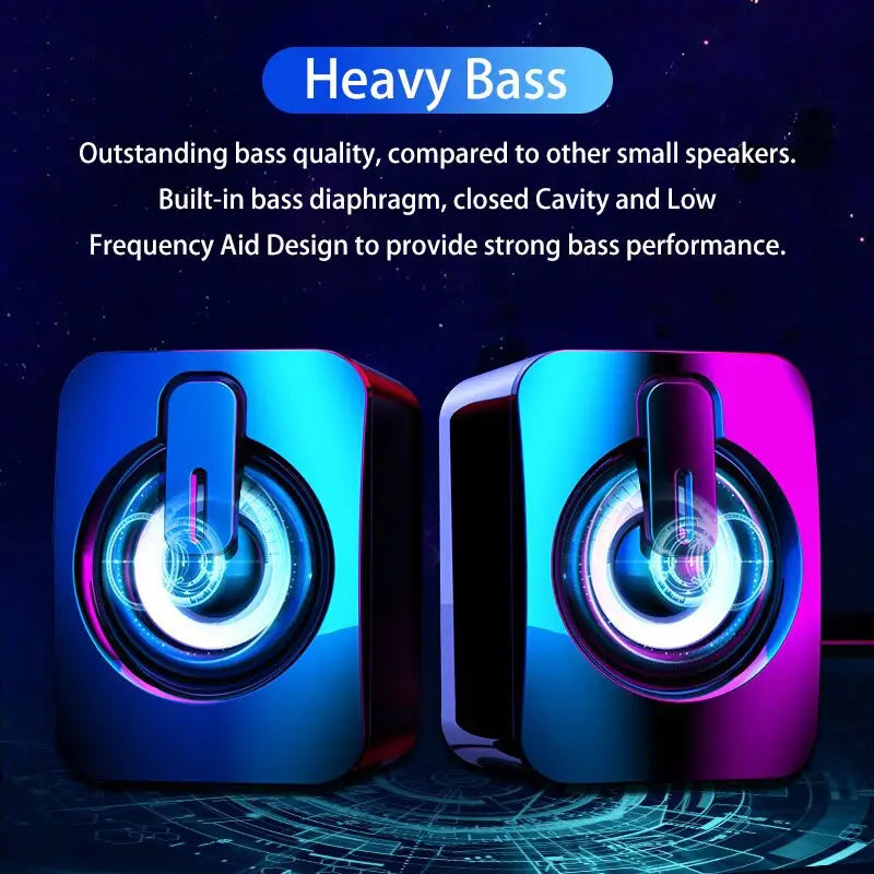 A pair of sleek rectangular usb computer speakers with vibrant blue and purple led lighting around the circular drivers.
