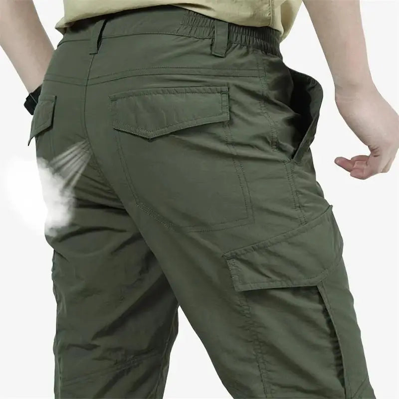 pantalons cargo tactiques légers pour homme en vert olive, avec plusieurs poches et une ceinture élastique pour un confort et une utilité améliorés.