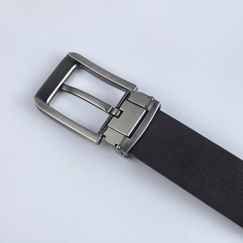 Black leather belt with a sleek silver toned metal buckle featuring a hidden tab closure for business casual style.