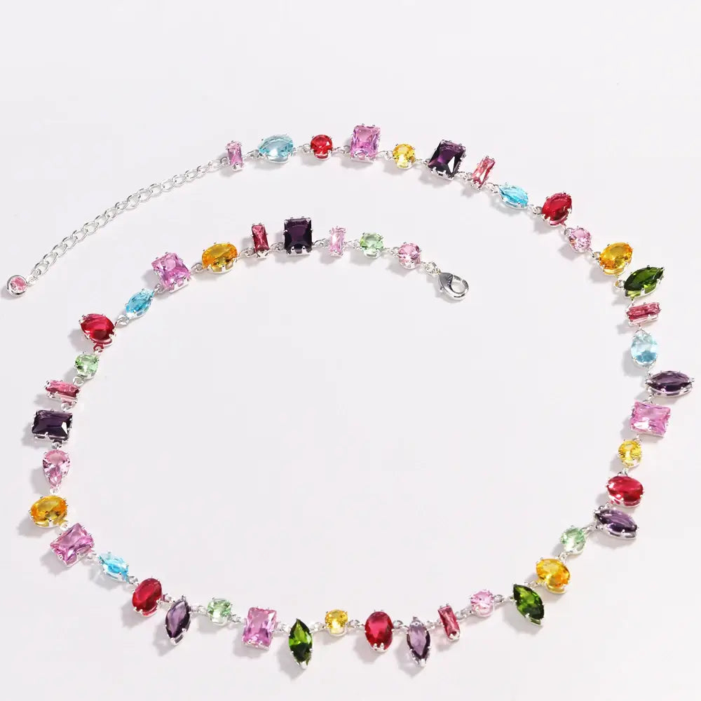 A colorful zircon crystal gold plated necklace featuring a vibrant multi-colored faceted gemstone design with a silver chain.