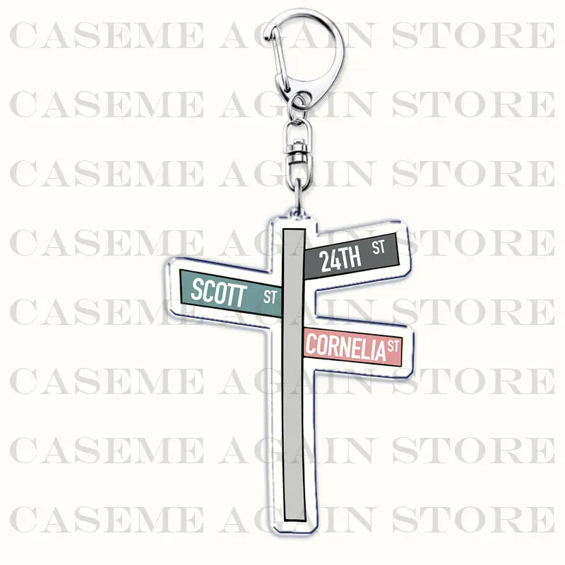 Silver acrylic street sign keychain featuring 24th st scott st and cornelia st in black white and pink lettering on green gray and red plaques for Gracie Abrams anime fan gift.