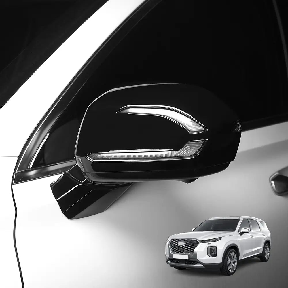 Black glossy Hyundai Palisade LED mirror cover with integrated LED lighting strip for 2020-2025 models showing the front side.