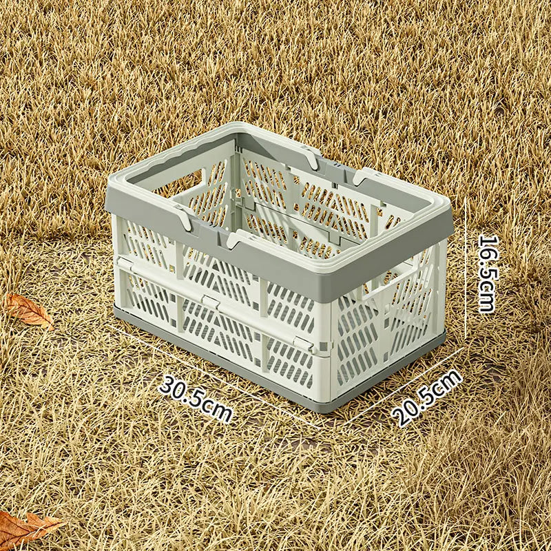 A compact foldable plastic storage basket in light gray and white pastel colors designed as a collapsible crate for versatile use.