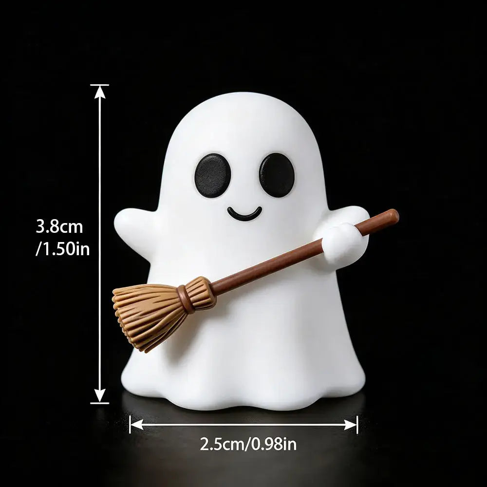 Leuchtende Halloween-Geister-Desktop-Dekorationsfigur in Weiß, die einen Miniaturbesen hält, mit schwarzen Augen und lächelndem Gesicht.