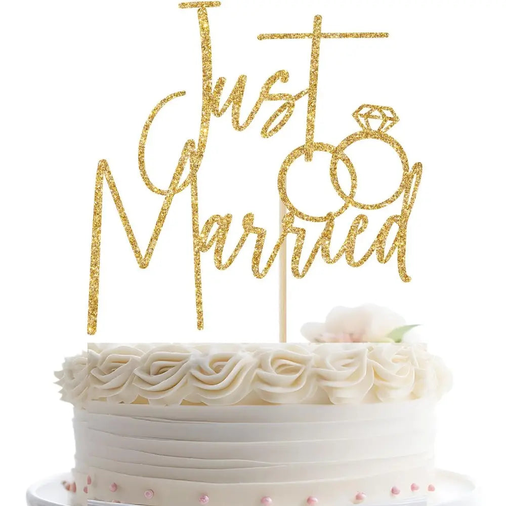 just married gold glitter cake topper featuring an interlocking rings design for wedding cake decoration.