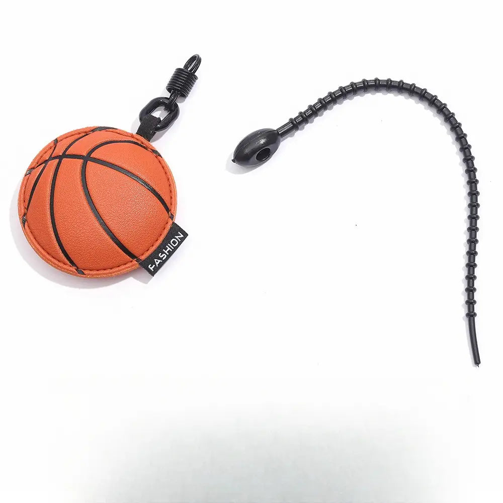 Leather sports ball keychain set bag charm featuring an orange basketball-themed leather keychain with black stitching and a black plastic clip.