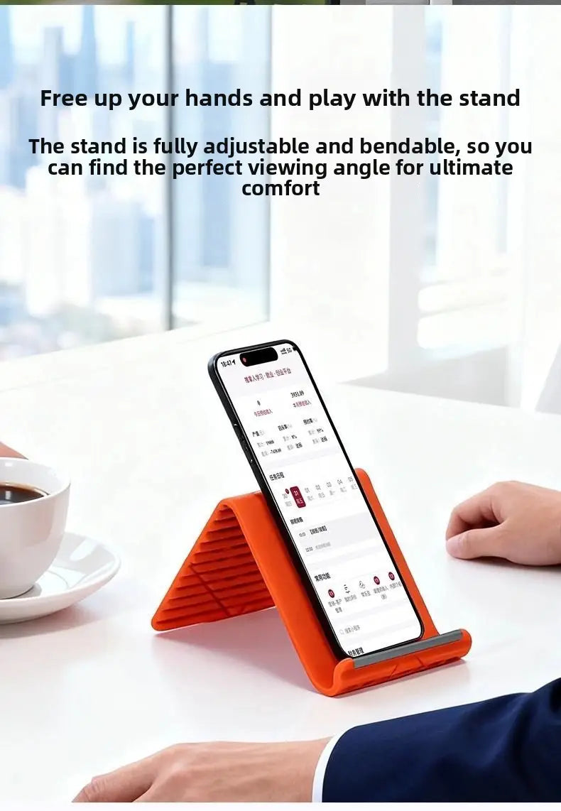 Soporte para teléfono plegable tipo perezoso con abrazadera de silicona flexible en color naranja, diseñado para un uso cómodo con manos libres.