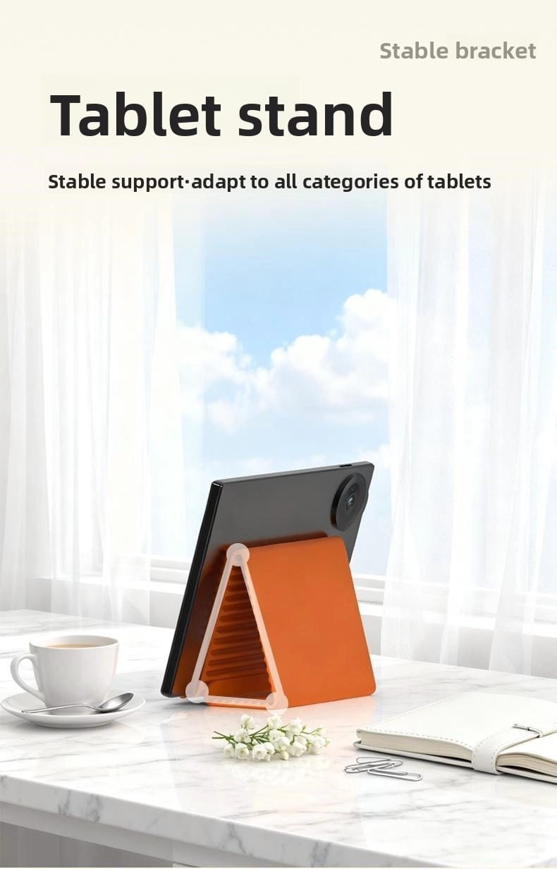 Soporte para teléfono plegable tipo perezoso de silicona en color naranja, con juntas de plástico blanco que sostienen una tableta negra.