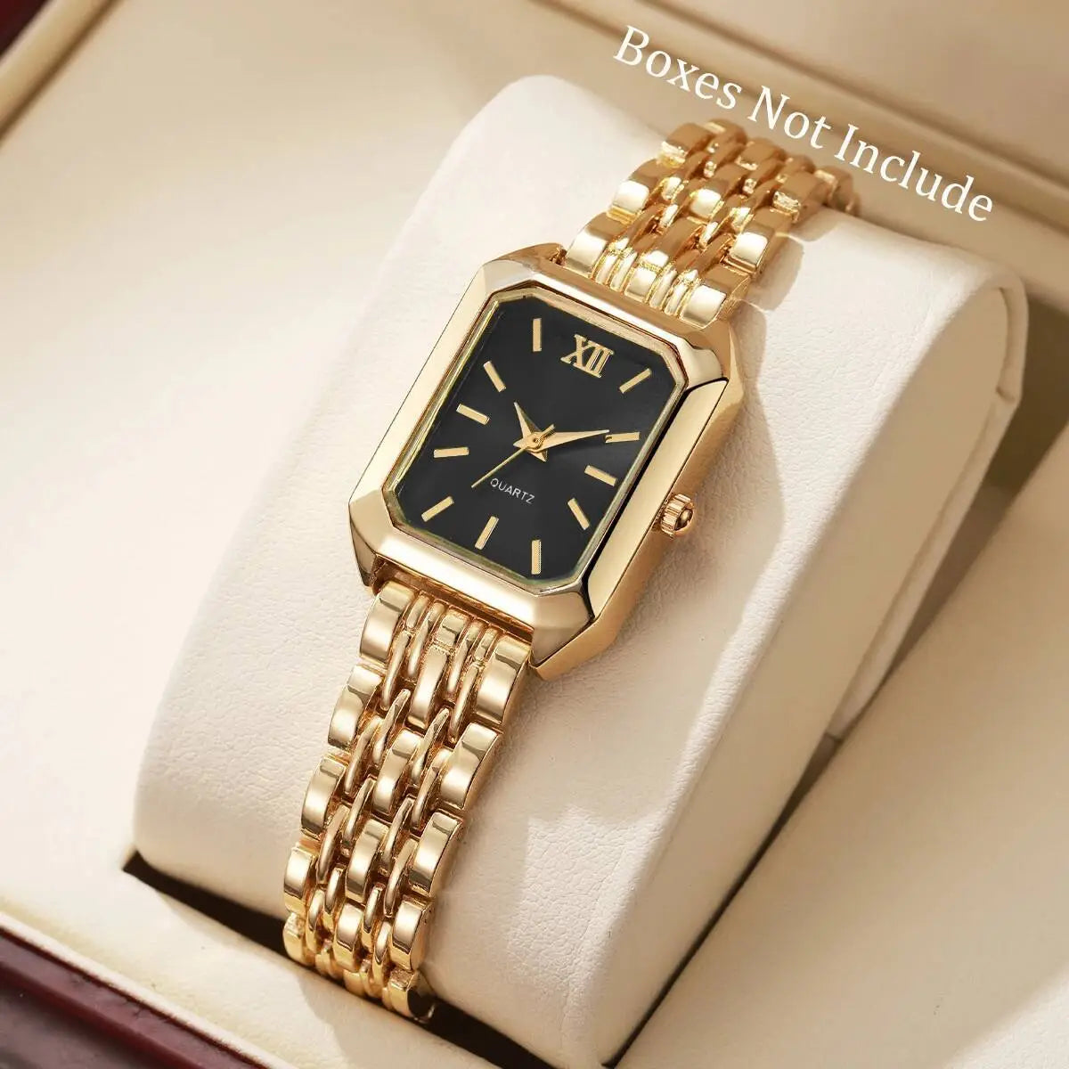 Women gold rectangle quartz watch with a black dial roman numeral hour markers and a gold-tone mesh strap.