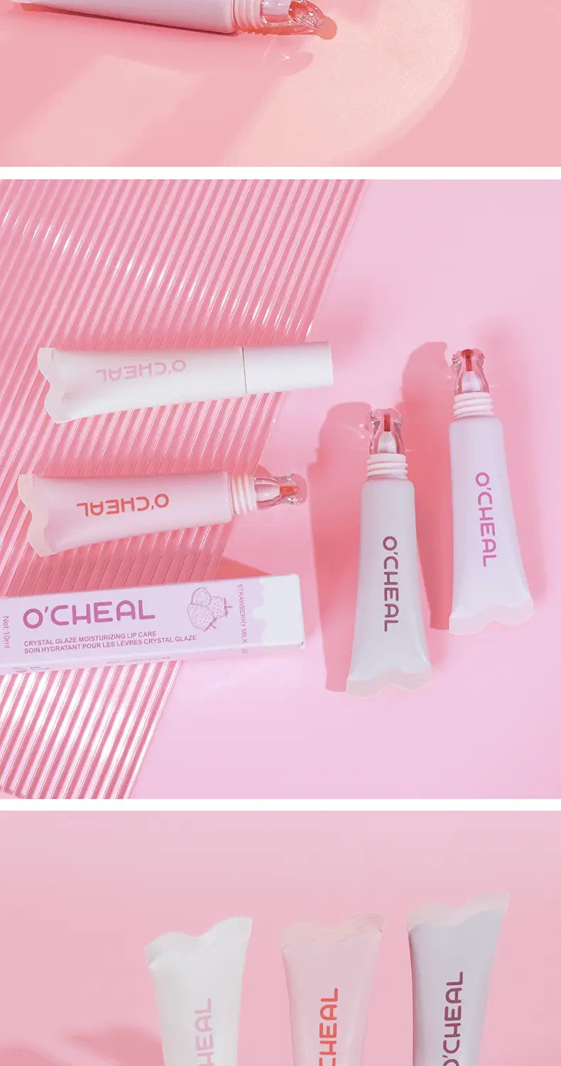 Pink and white ocheal crystal glass tubes with clear glass caps containing hydrating fruit flavored glossy lip balm.