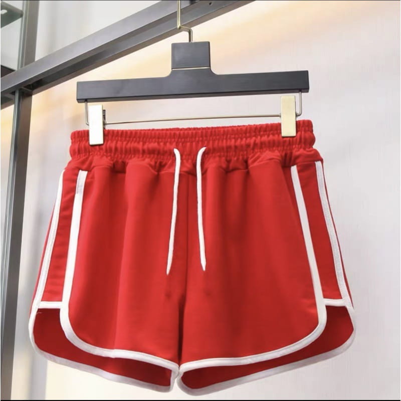 Red men athletic shorts with white side stripes and a matching drawstring waistband designed for running and sports activities.