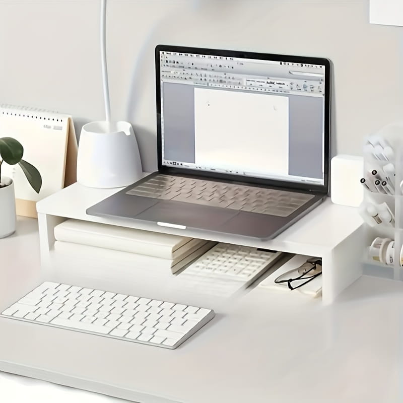 Weißer minimalistischer Monitorständer mit integrierter Tastaturablage und Staufächern, ausgelegt für eine ergonomische Arbeitsplatzzorganisation.