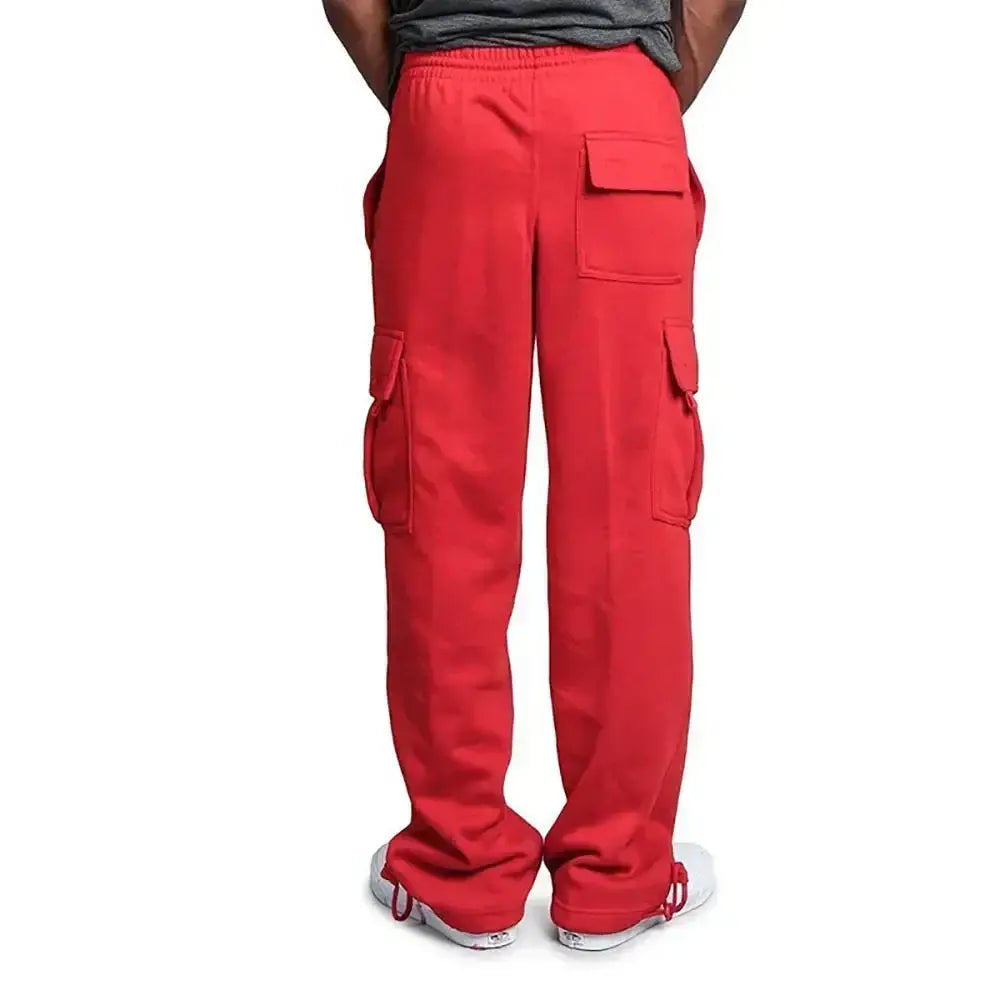 Pantalons cargo rouges pour homme, avec plusieurs poches et une ceinture élastique, avec une conception à coupe ample pour un usage décontracté.