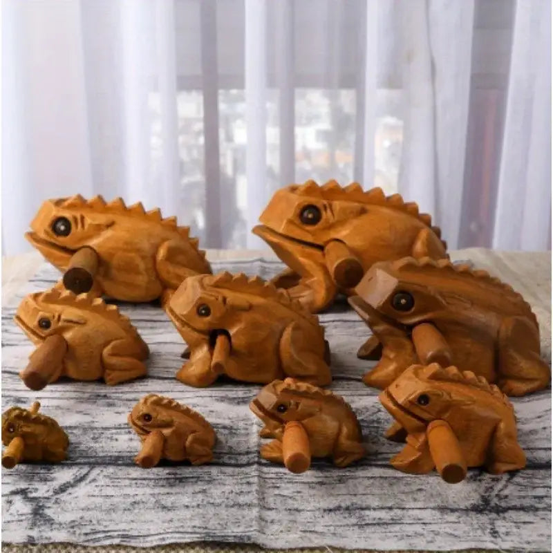 Hand carved wooden frog instrument with smooth warm brown rain wood finish and detailed spiky frog body used as percussion instrument and home decor.
