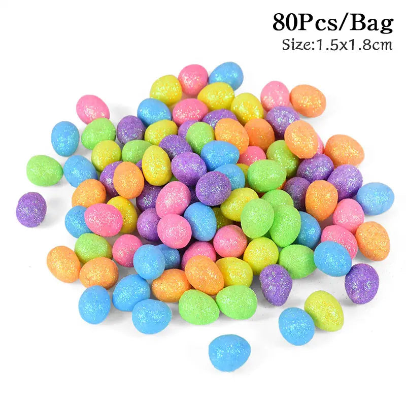 A pile of 80 colorful glitter Easter foam eggs in assorted pastel shades including pink blue green yellow orange and purple for DIY party decor.
