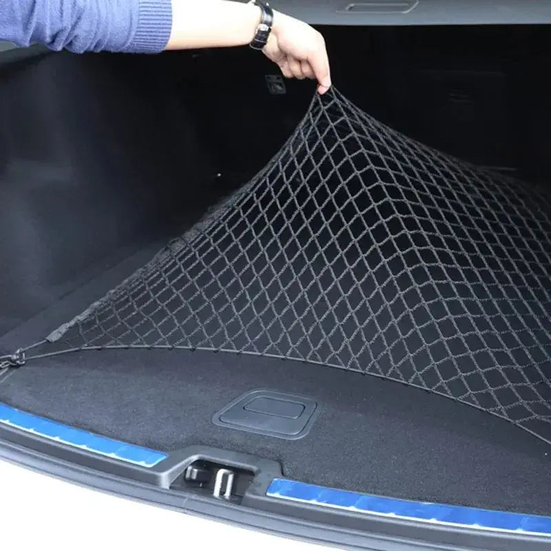 Black diamond-patterned mesh cargo net made of nylon for car trunk storage organization.