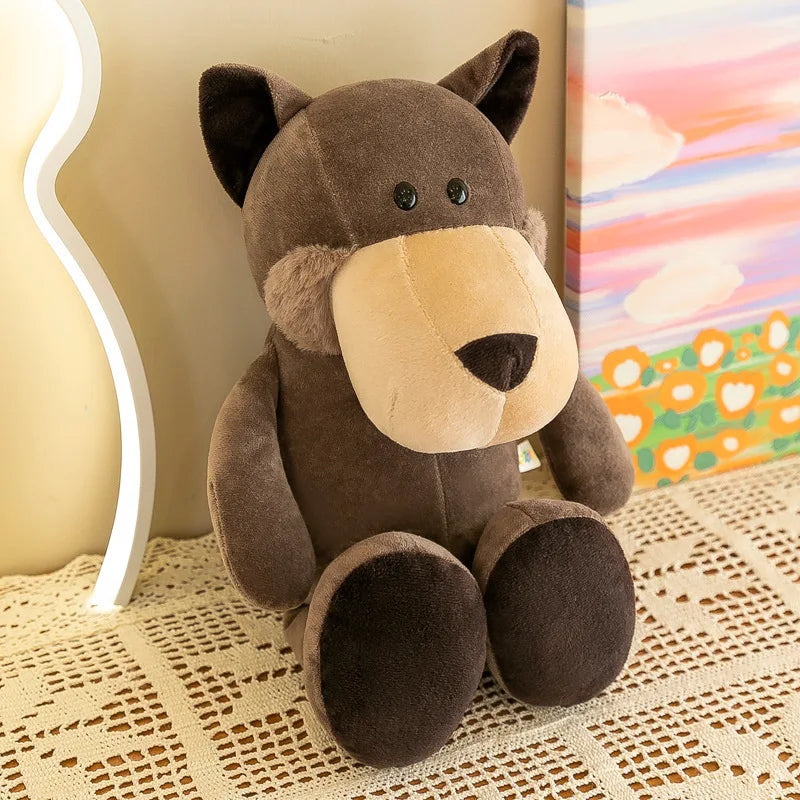 un peluche de lobo marrón con hocico color canela y nariz negra, hecho de material terciopelo suave; aparece en la colección de muñecos blandos de animales de la jungla.