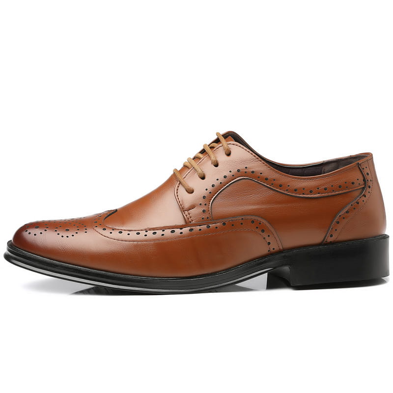 Men’s leather brogue dress shoes in brown with perforated detailing and a black rubber sole.