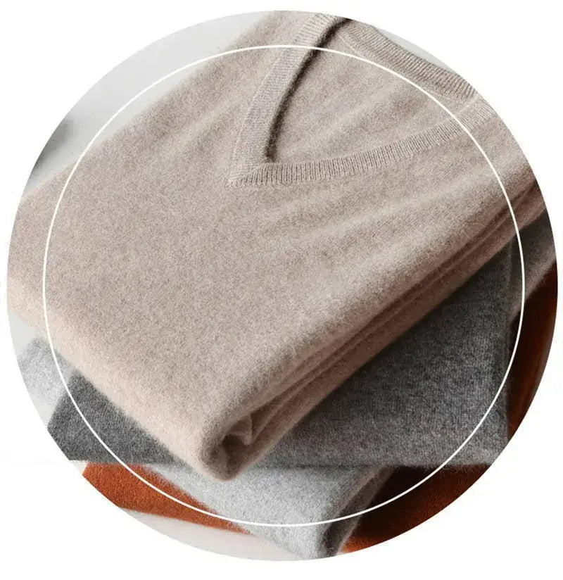 Men cashmere v neck pullover sweater in soft beige with fine knit texture and ribbed trim.