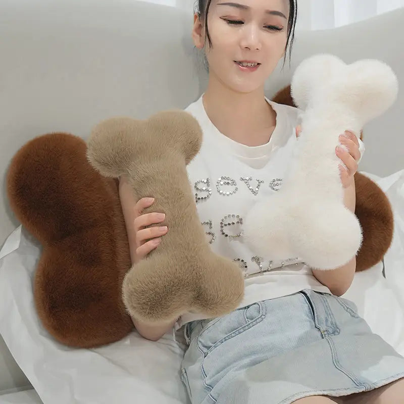 soft, fluffy tan and white bone shape plush pillows designed as kawaii bone shape plush nap cushions for comfortable rest.