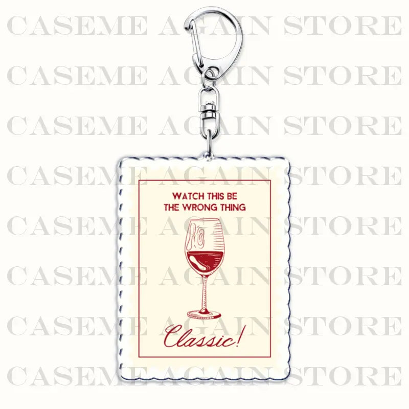 A rectangular cream-colored acrylic keychain with red text and a silver metal clasp featuring an illustration of a wine glass labeled classic designed for Gracie Abrams anime fan gifts.