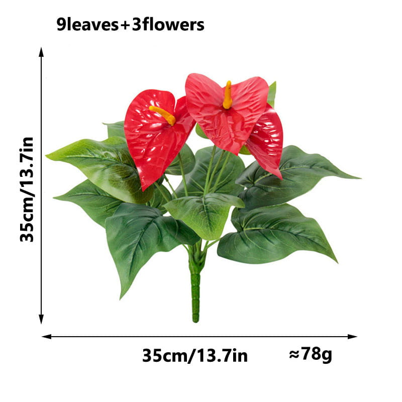 Artificial red anthurium potted plant featuring three vibrant red flowers with yellow centers and nine glossy green leaves on a sturdy stem.