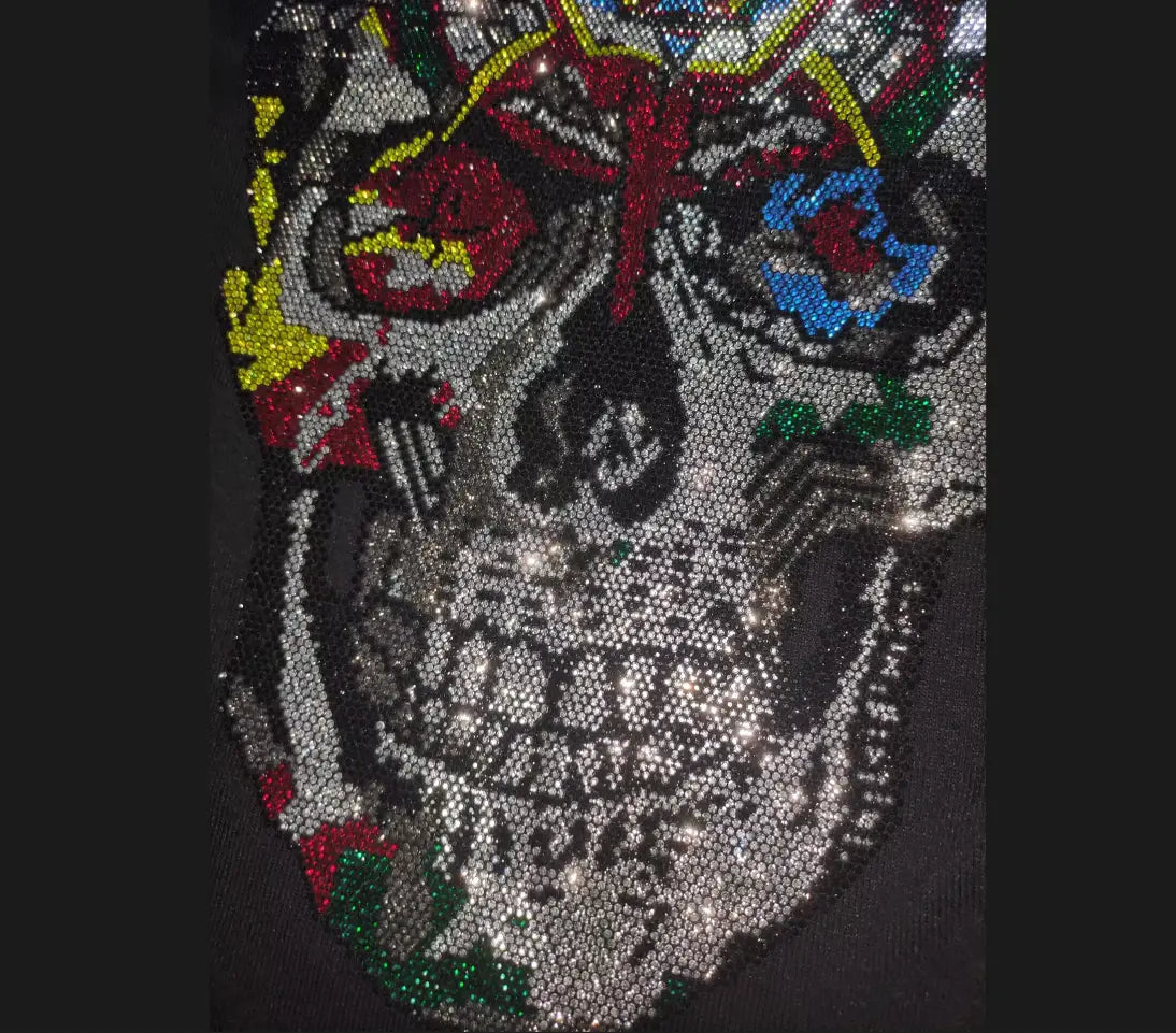 Men rhinestone devil bear graphic tee featuring a dazzling sequined skull patch with vibrant red yellow blue and green embellishments on black fabric