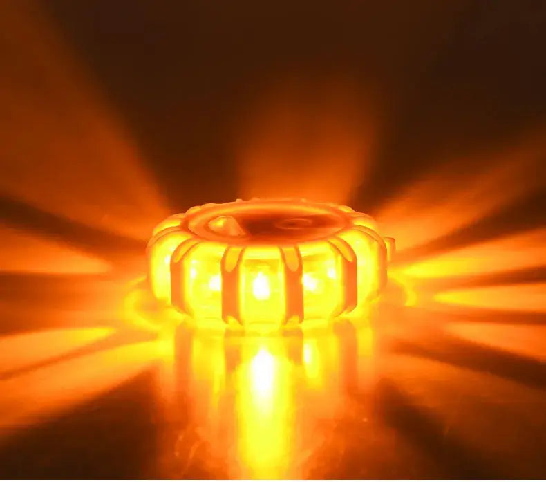 a magnetic led roadside emergency strobe light featuring a glowing orange circular segmented design with bright illumination for enhanced safety visibility.