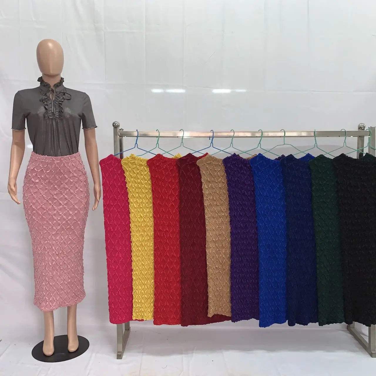 pink textured high waist knit midi skirt slim fit displayed on a mannequin