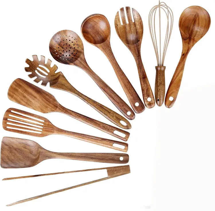 Wooden kitchen utensil set featuring natural wood grain with rounded handles including spoons spatulas a slotted spoon a whisk and tongs for cooking.