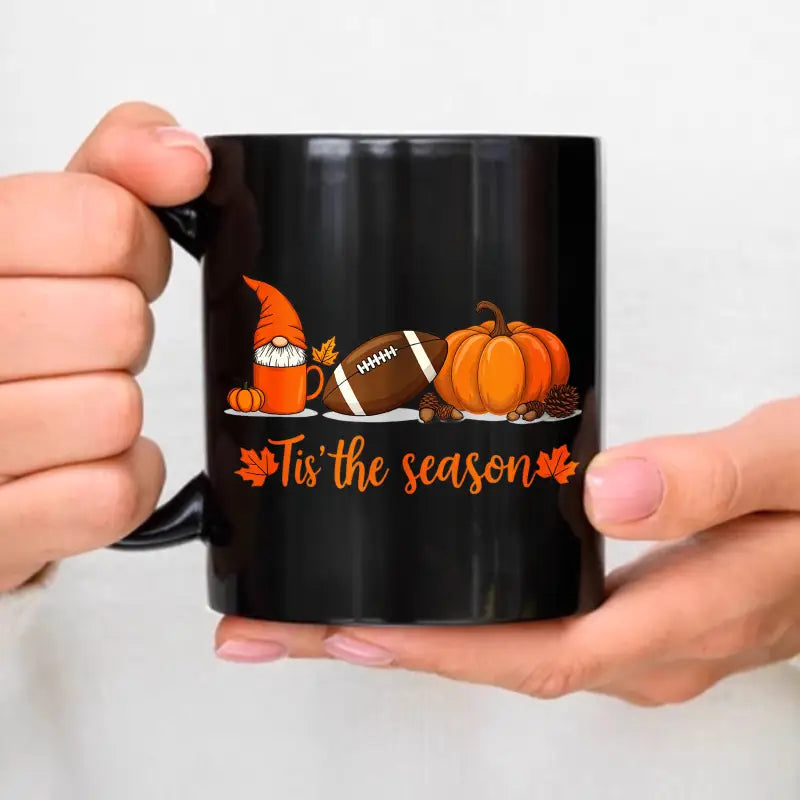black ceramic Easter egg coffee mug featuring a festive autumn design with an orange gnome football and pumpkin