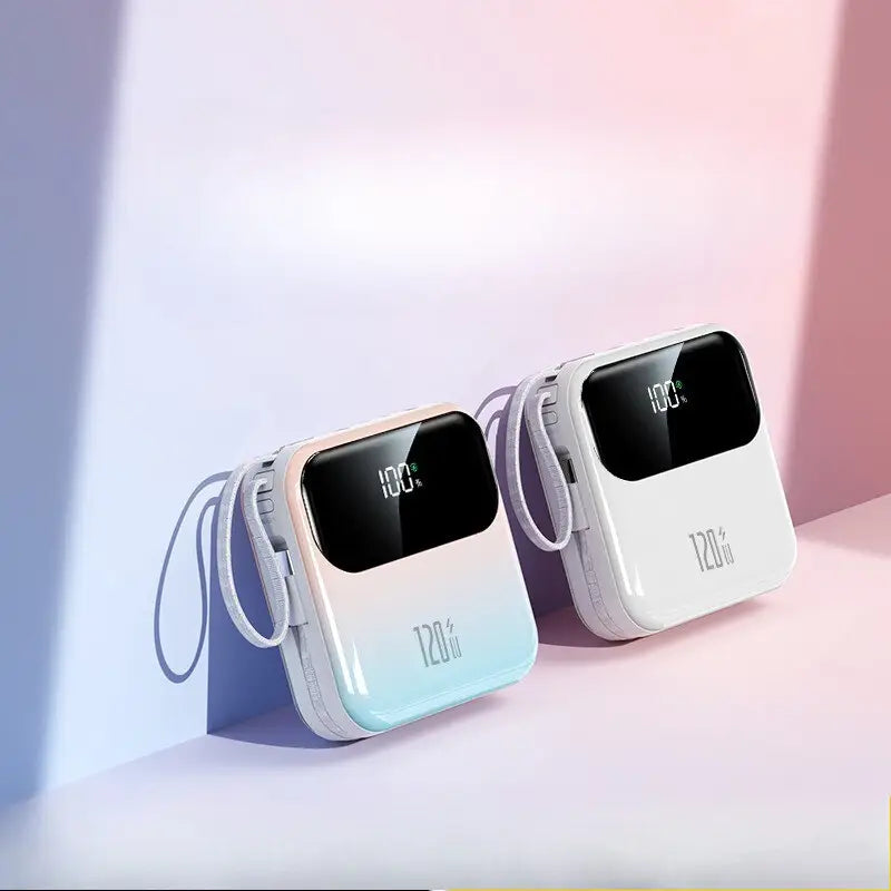 Two compact gradient-colored pastel power banks with 20000mah capacity 120w fast charging and digital displays showing 100 percent charge.