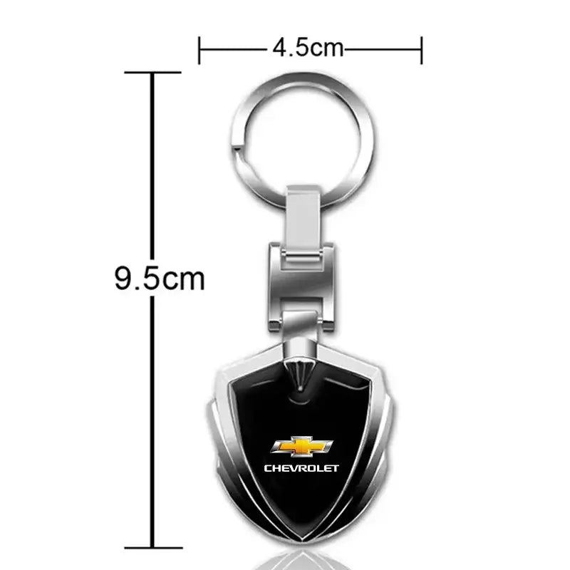 Silver and black Chevrolet metal shield car keychain with chrome finish and shield-shaped design