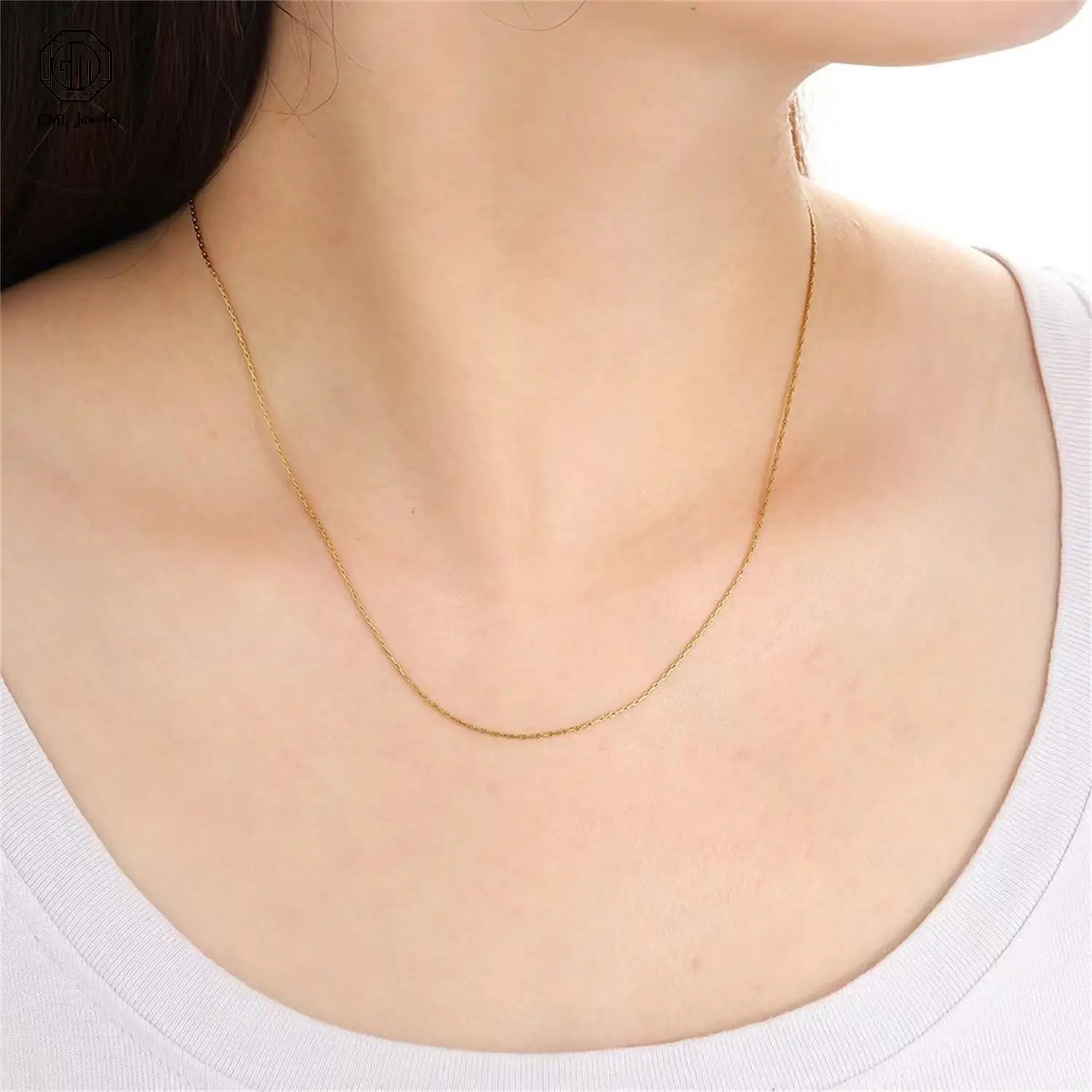 a delicate gold-toned chain necklace featuring a fine continuous link design worn gracefully around the neck paired with a sand gold adjustable ring matte wide band unisex that is fade resistant and gold adjustable ring