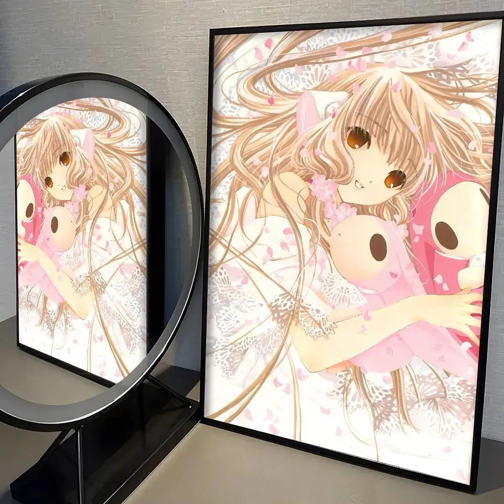 A framed kawaii girl cute anime wall art print poster featuring a girl with long blonde hair and brown eyes holding a pink plush toy against a backdrop of falling petals in a modern graphic style.