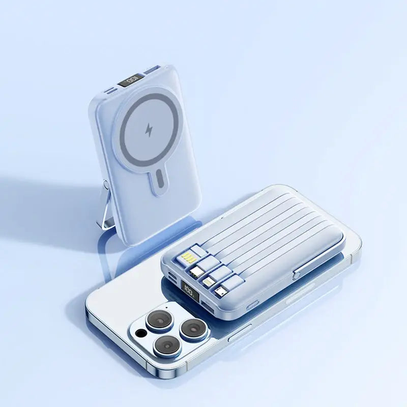 Banco de energía con cargador inalámbrico color plata con almohadilla magnética circular y soporte integrado para carga rápida y uso manos libres.