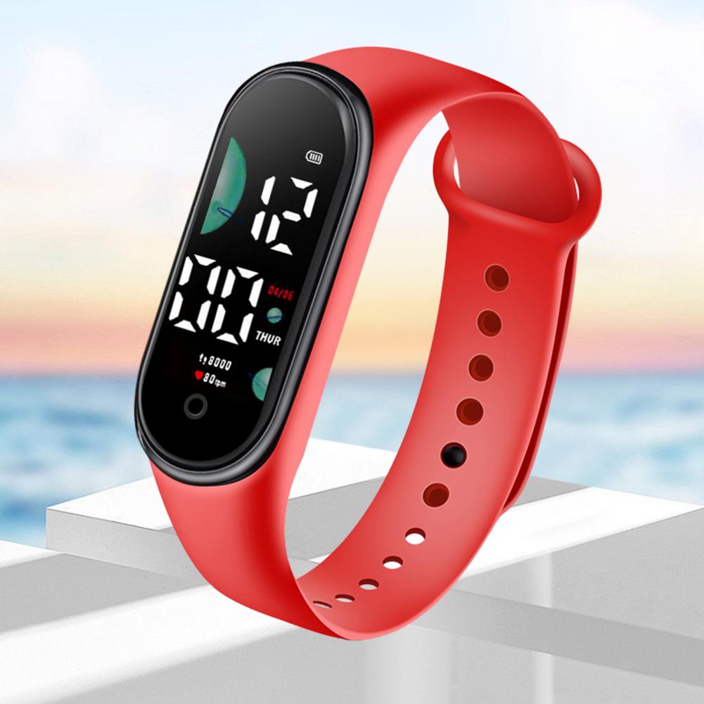 Red silicone strap electronic watch with large font screen digital display showing time date and step count designed for sports use
