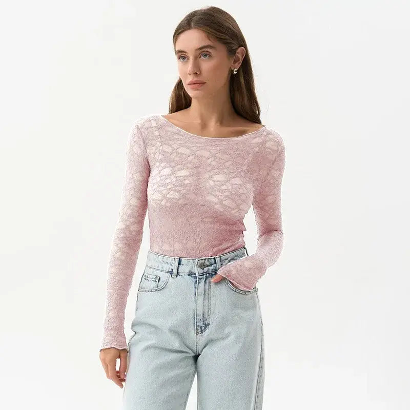 A delicate pink lace long-sleeved crop top with a soft sheer texture and an elegant boat neckline designed for women aesthetic clothes.