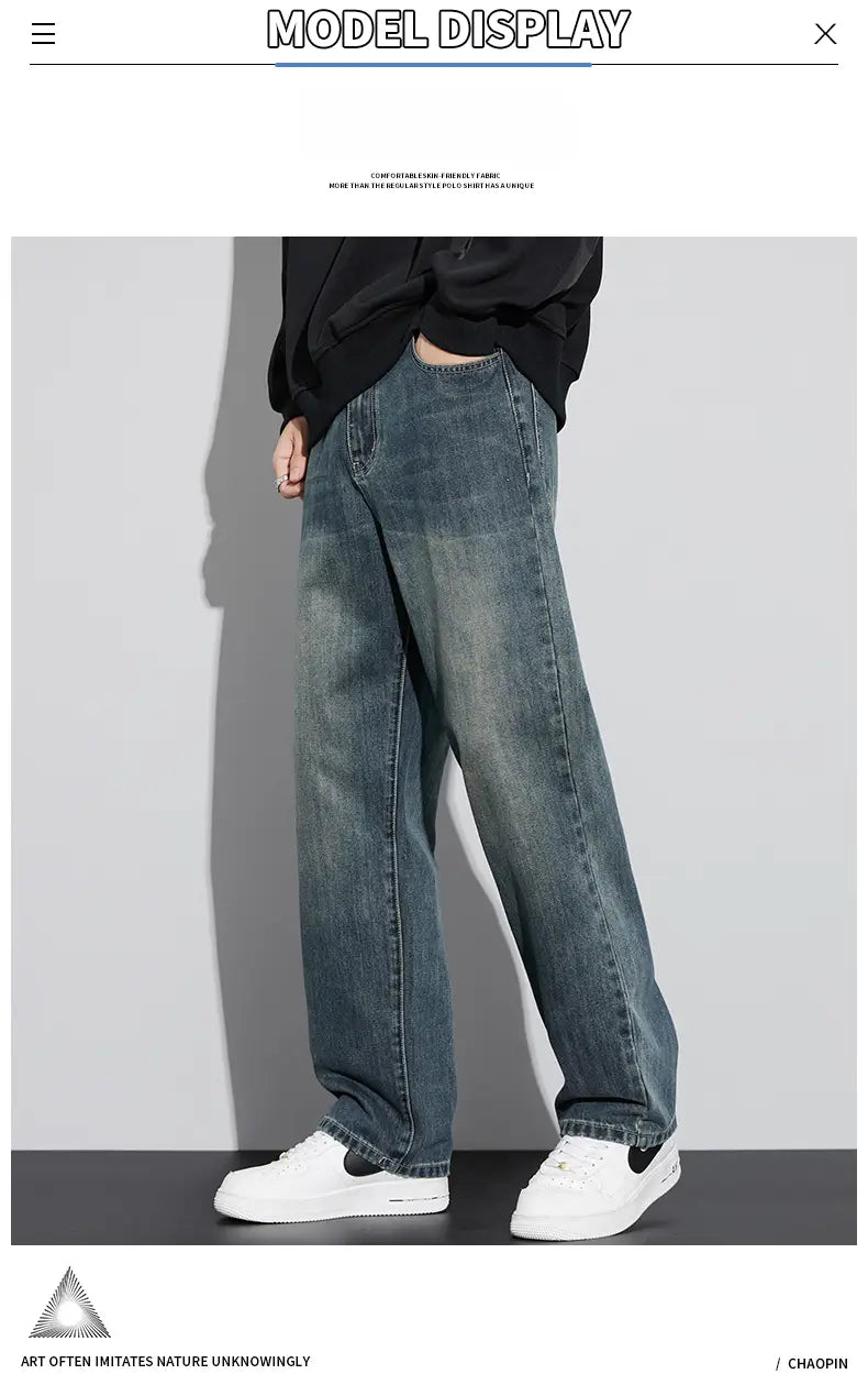 Jeans droits amples doublés de polaire pour homme en denim large délavé bleu, avec un effet de dégradation subtil et une couture classique.