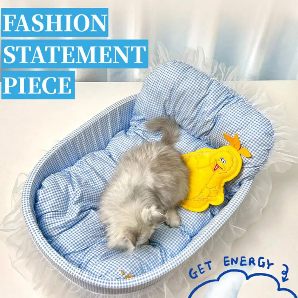 blue and white checkered oval lace edge plush cat sofa bed with a yellow chick toy inside