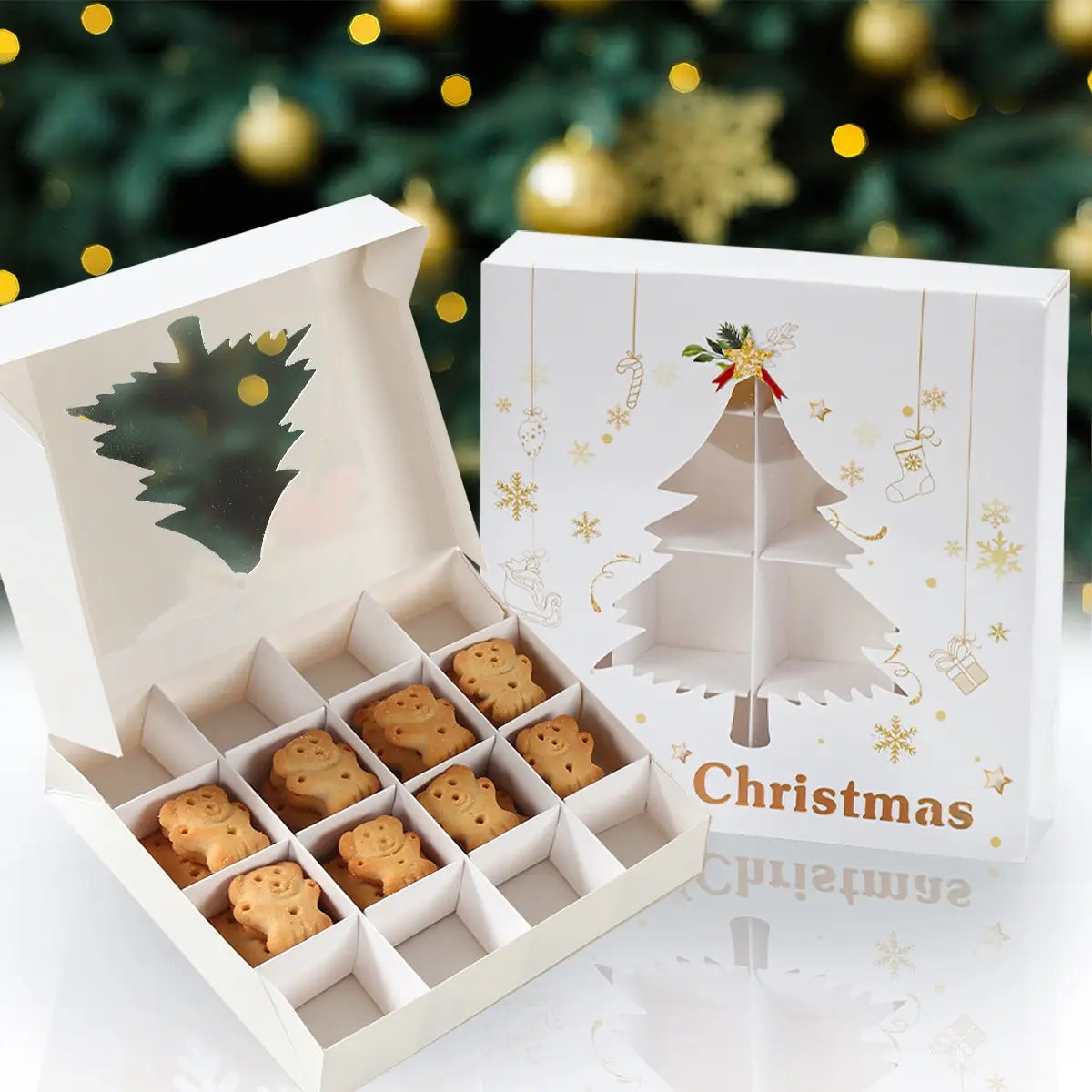 white christmas-themed gift box with gold foil accents and festive tree design containing golden-brown bear-shaped cookies for holiday packaging