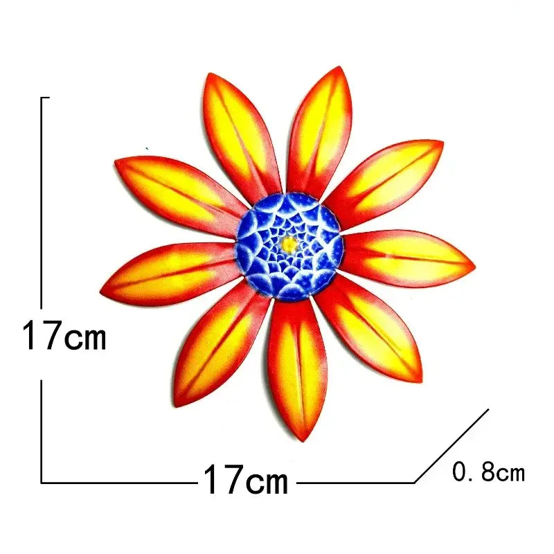 Metal flower wall art sculpture featuring vibrant orange and yellow metal sunflower decor with a detailed blue center.
