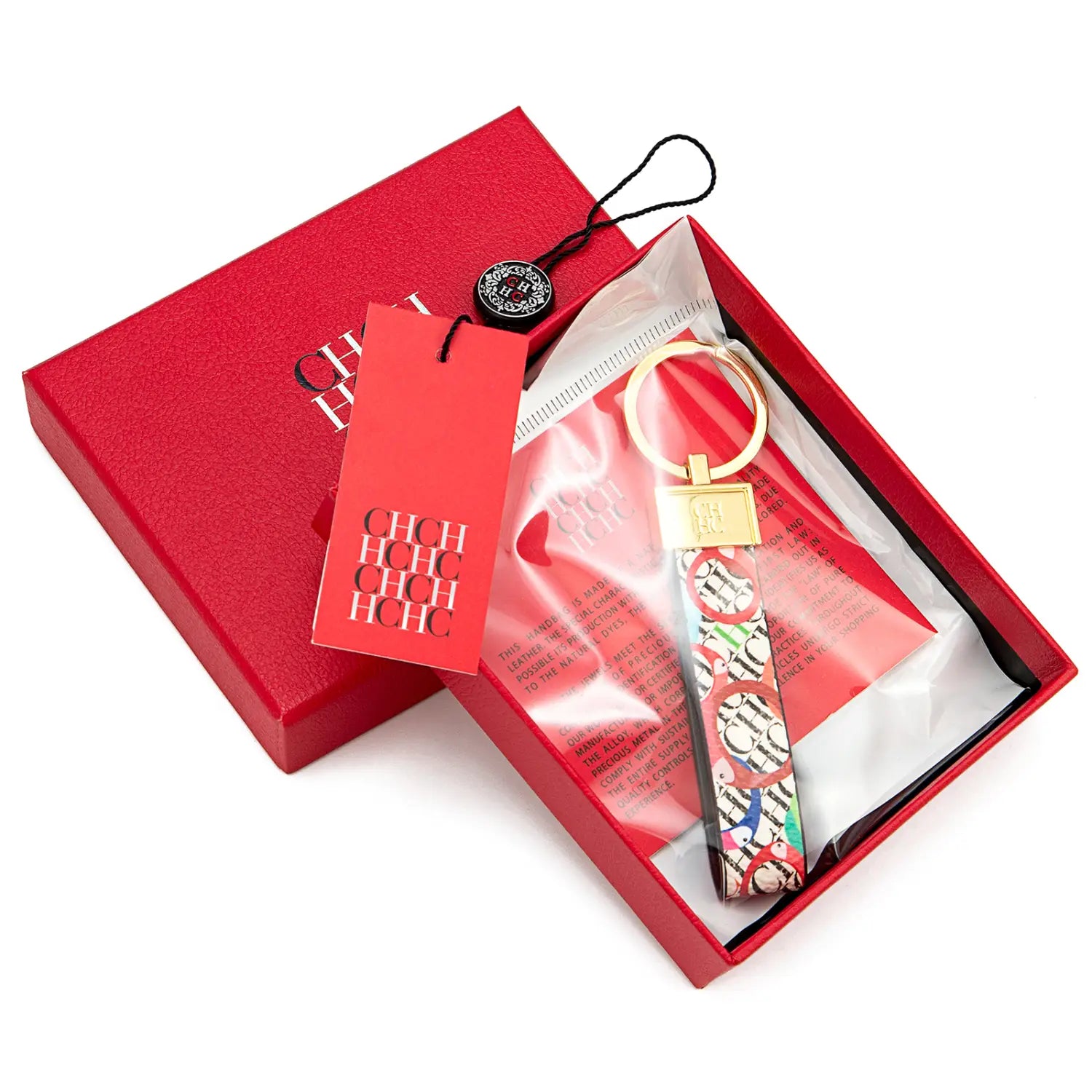 A colorful patterned leather logo keychain with a gold-tone metal ring and clasp designed as a fashion accessory gift.