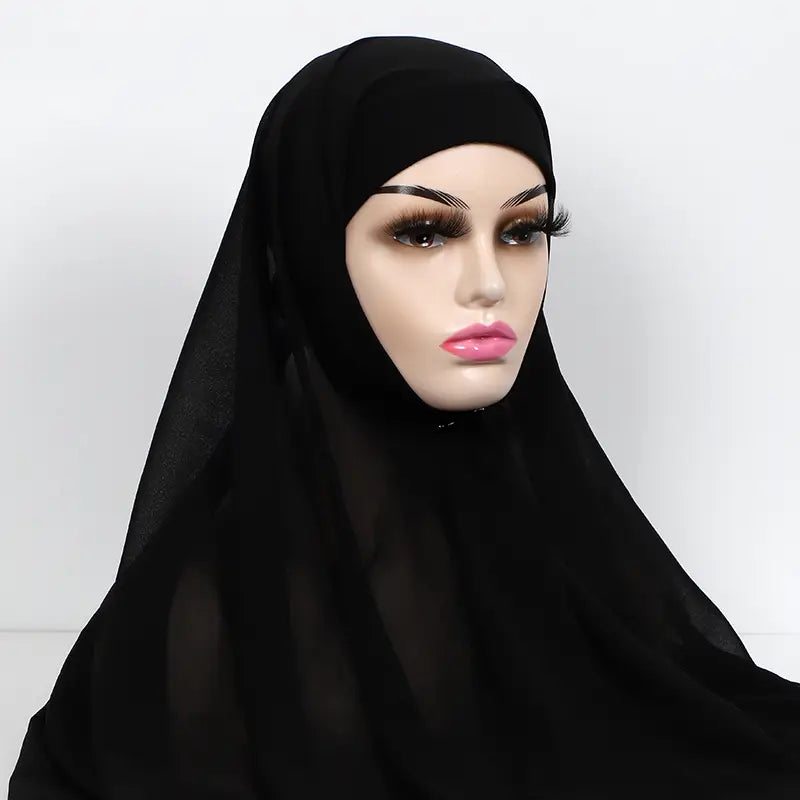 black sheer chiffon instant hijab with cap bonnet displayed on a mannequin head