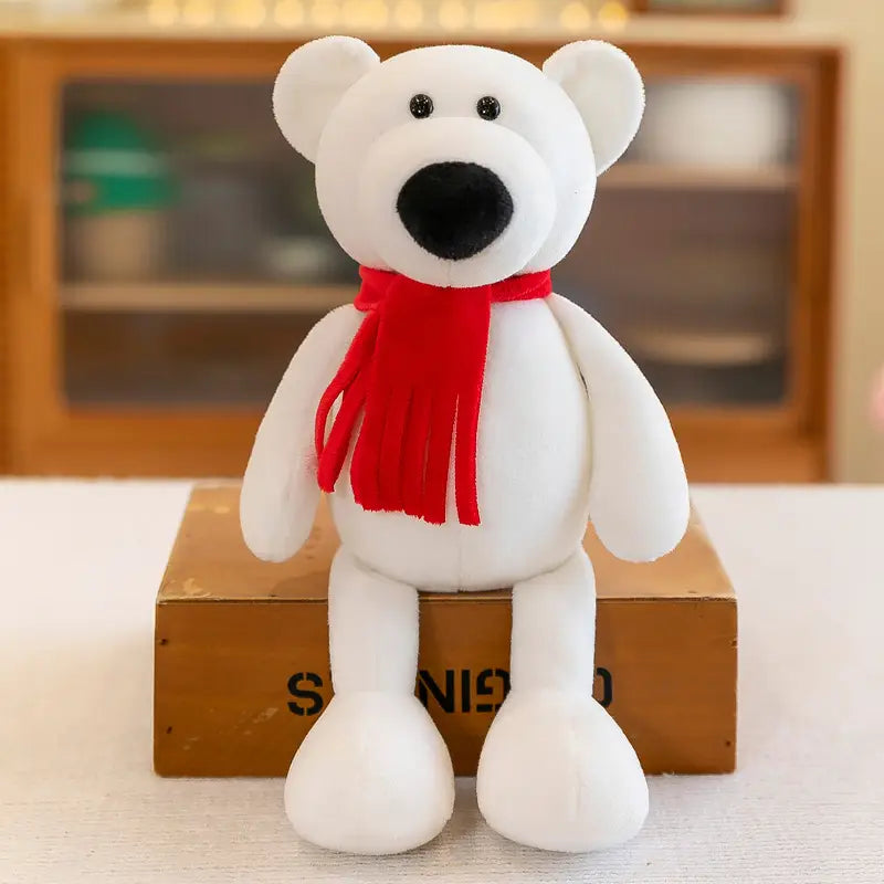 Jouet ours polaire blanc, fabriqué dans un matériau souple, avec yeux et nez à boutons noirs, portant une écharpe rouge à franges, parmi les animaux en peluche rembourrés, notamment les jouets lion éléphant tigre de la forêt.