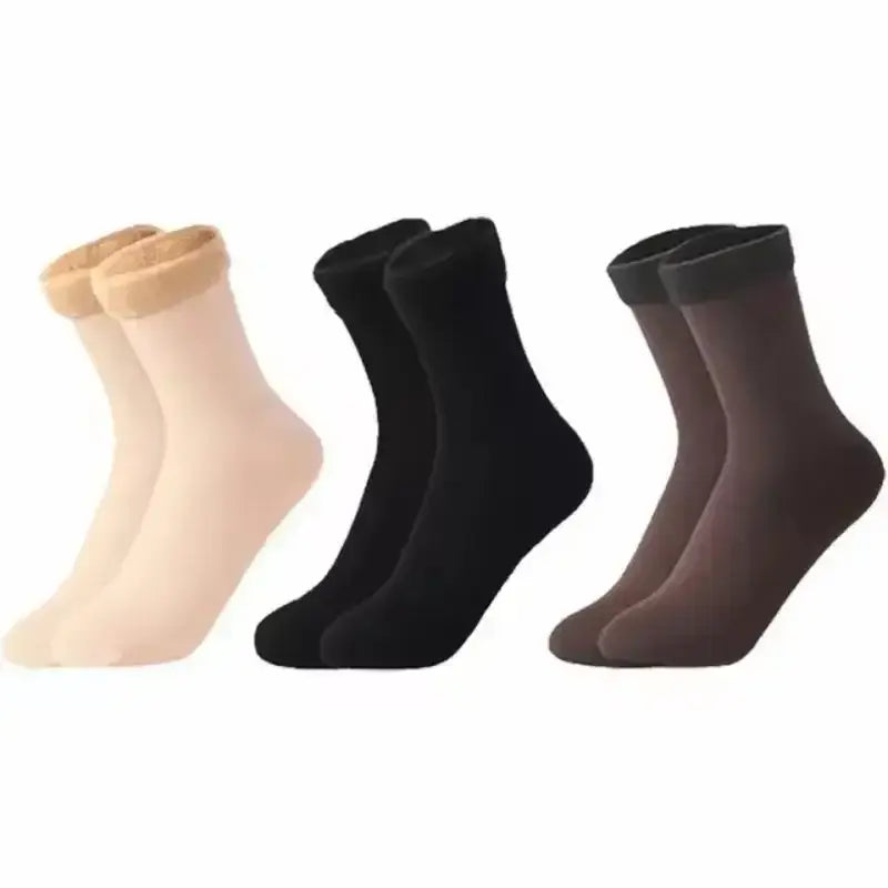 Three pairs of sheer ankle-length winter thermal socks in beige black and brown with ribbed cuffs made from cashmere wool and fleece lined for warmth.